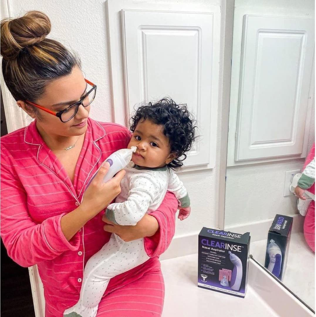 Image of a mother using CLEARinse to gently and safely clear her baby's stuffy nose