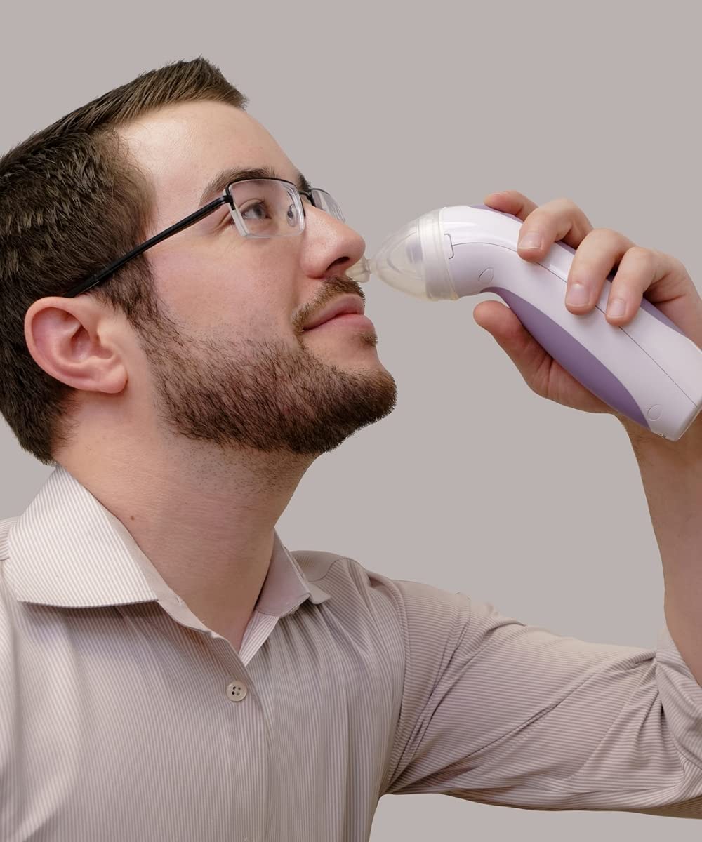 Image of a man using CLEARinse to safely and effectively clear his nasal passages